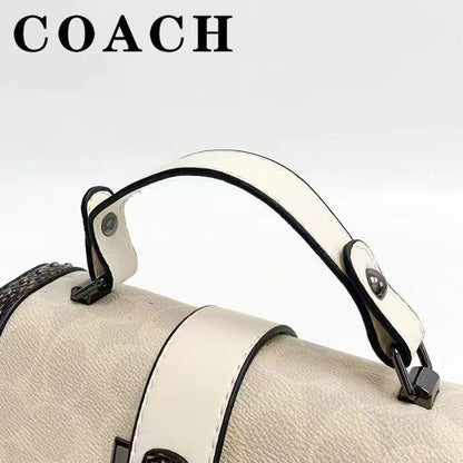 Coach 
Studded Flap Sling Bag