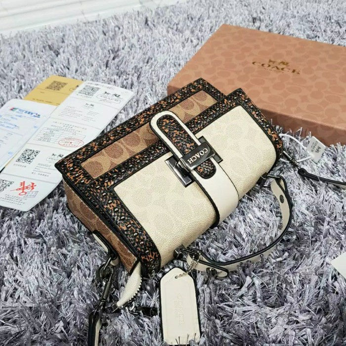 Coach 
Studded Flap Sling Bag