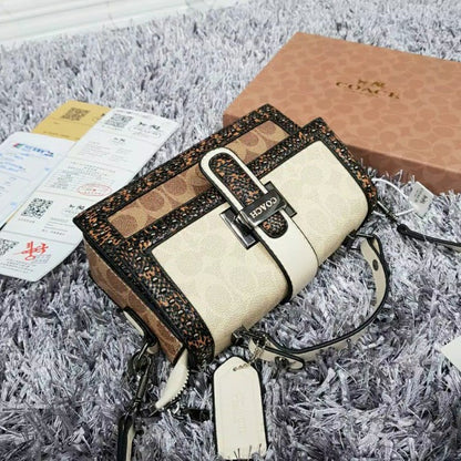 Coach 
Studded Flap Sling Bag