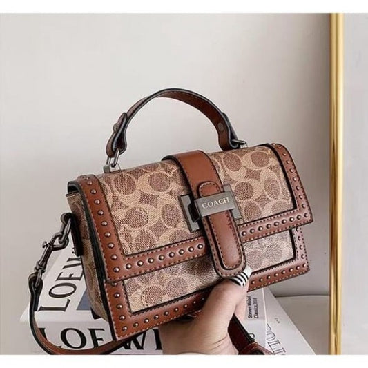 Coach 
Studded Flap Sling Bag