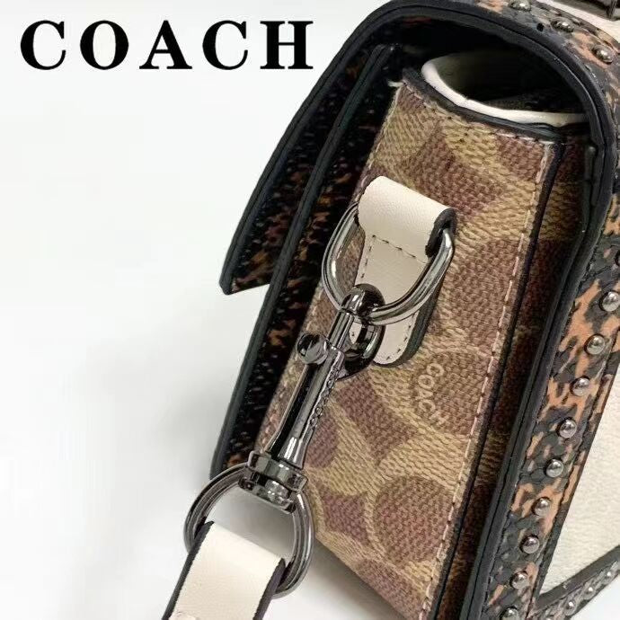 Coach 
Studded Flap Sling Bag
