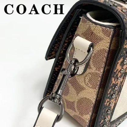 Coach 
Studded Flap Sling Bag