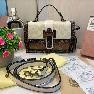 Coach 
Studded Flap Sling Bag